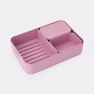 Contenedor de almuerzo bento Brabantia abierto mostrando su interior compartimentado